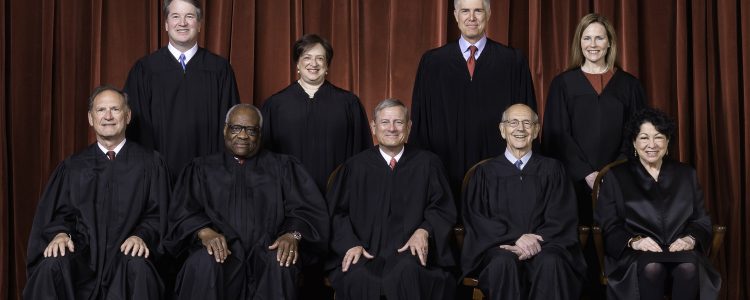 The Roberts Court, April 23, 2021  
Seated from left to right: Justices Samuel A. Alito, Jr. and Clarence Thomas, Chief Justice John G. Roberts, Jr., and Justices Stephen G. Breyer and Sonia Sotomayor  
Standing from left to right: Justices Brett M. Kavanaugh, Elena Kagan, Neil M. Gorsuch, and Amy Coney Barrett.  
Photograph by Fred Schilling, Collection of the Supreme Court of the United States